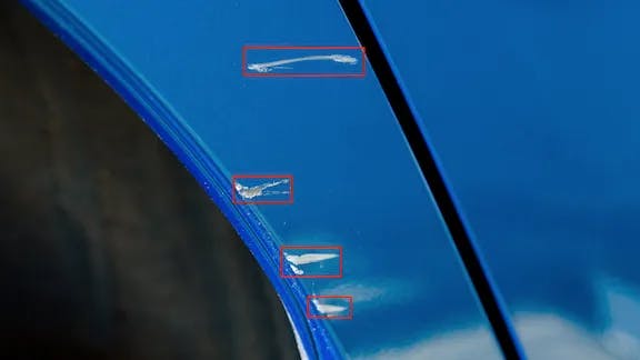 Detecting system pointing out scratches on a surface