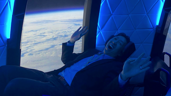 Andrew Ng sitting in the Blue Origin passenger capsule