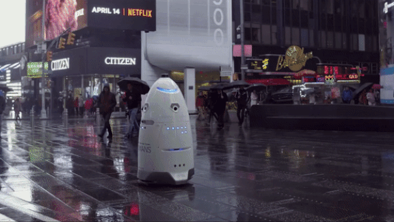 Security robot walking on the street