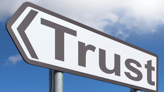 Road sign with the word "trust"