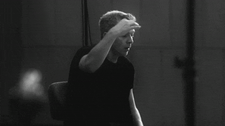 GIF showing an orchestra playing music
