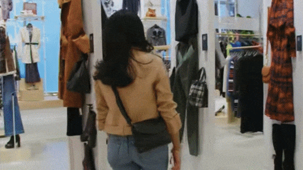 Woman walking on a store scanning codes