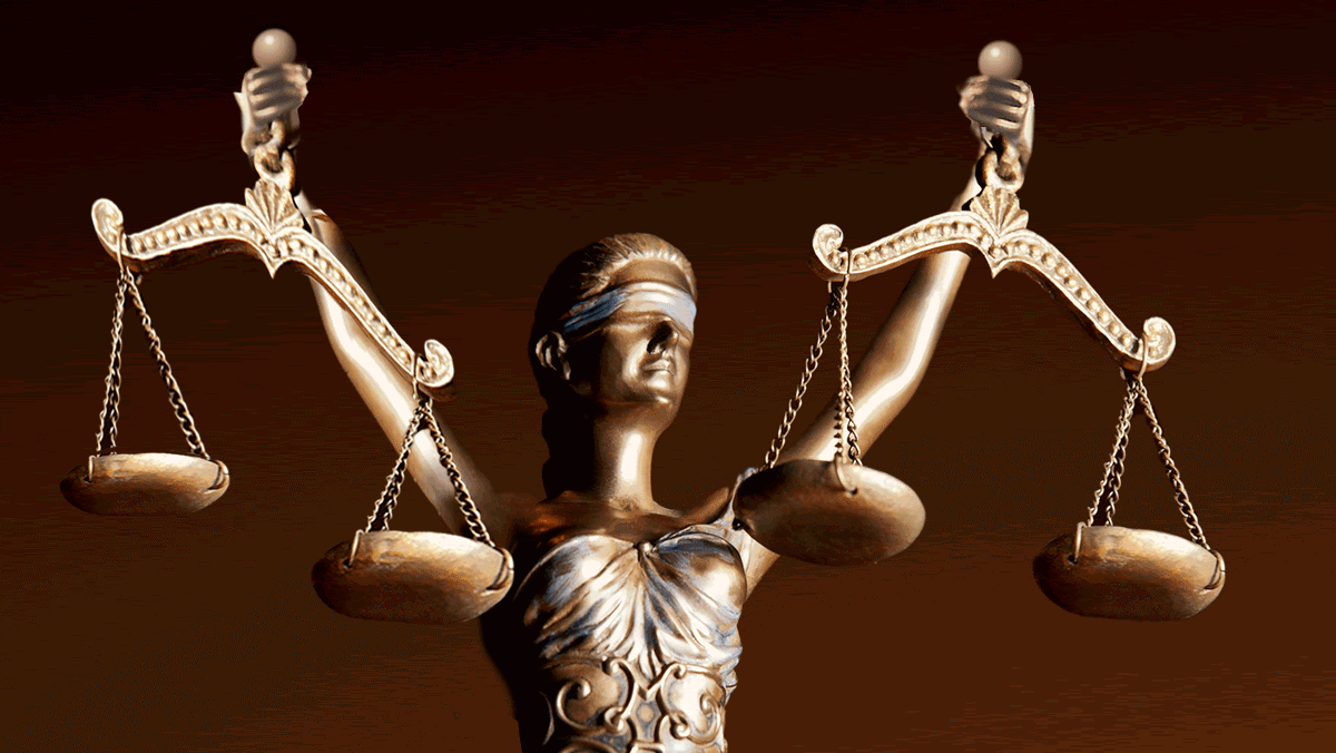 A statue of Lady Justice holds a set of scales in each hand, signifying inconsistent decision making. 