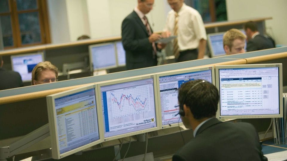 People working on a trading room