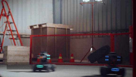 Two toy robots racing