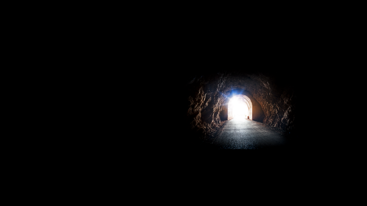 Photograph of light at the end of a tunnel